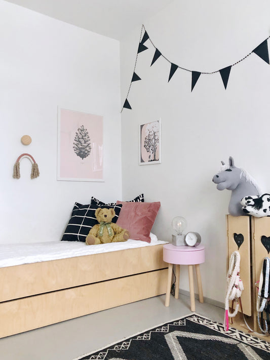 Piilo stool in peony pink color as a bedside table.